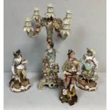 A Dresden style porcelain four-light candelabra, modelled in a rustic style with female figure and
