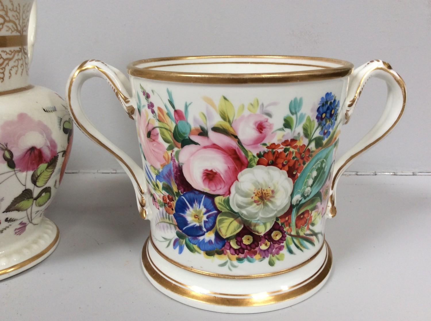 An early 19th century Staffordshire porcelain two-handled loving cup painted with roses and gilt - Image 2 of 5