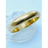 ADDENDUM: 18CT NOT 22CT. An 18ct gold D-shape wedding ring, weighing 7.8 grams, finger size 'U'