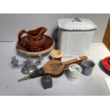 A white enamelled bread bin with blue handles to the side and top together with some brass studded