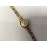 A ladies 9ct gold Rotary wristwatch, the silvered dial with batons denoting hours and quarterly