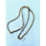 A 9ct gold solid heavy curb link chain, weighing 64.0 grams, measuring 24 inches in length,