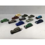 A collection of 13 assorted playworn Dinky Toy cars comprising two Lincoln Zephyrs in green and