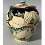 A Moorcroft pottery vase and cover of ovoid form decorated in the 'Paradise Flower' pattern after