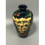 A Moorcroft Collectors Club pottery vase of baluster form and designed by Philip Gibson in the '