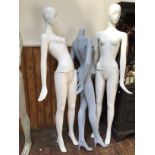 Five various mannequins and additional legs, some with stands