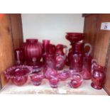 SECTION 29. A quantity of Cranberry glass including jugs, bowls, bell, scalloped dishes and