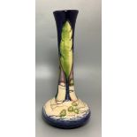 A Moorcroft Pottery vase of Persian bottle form, decorated in the "Poplars' pattern, 'adapted by