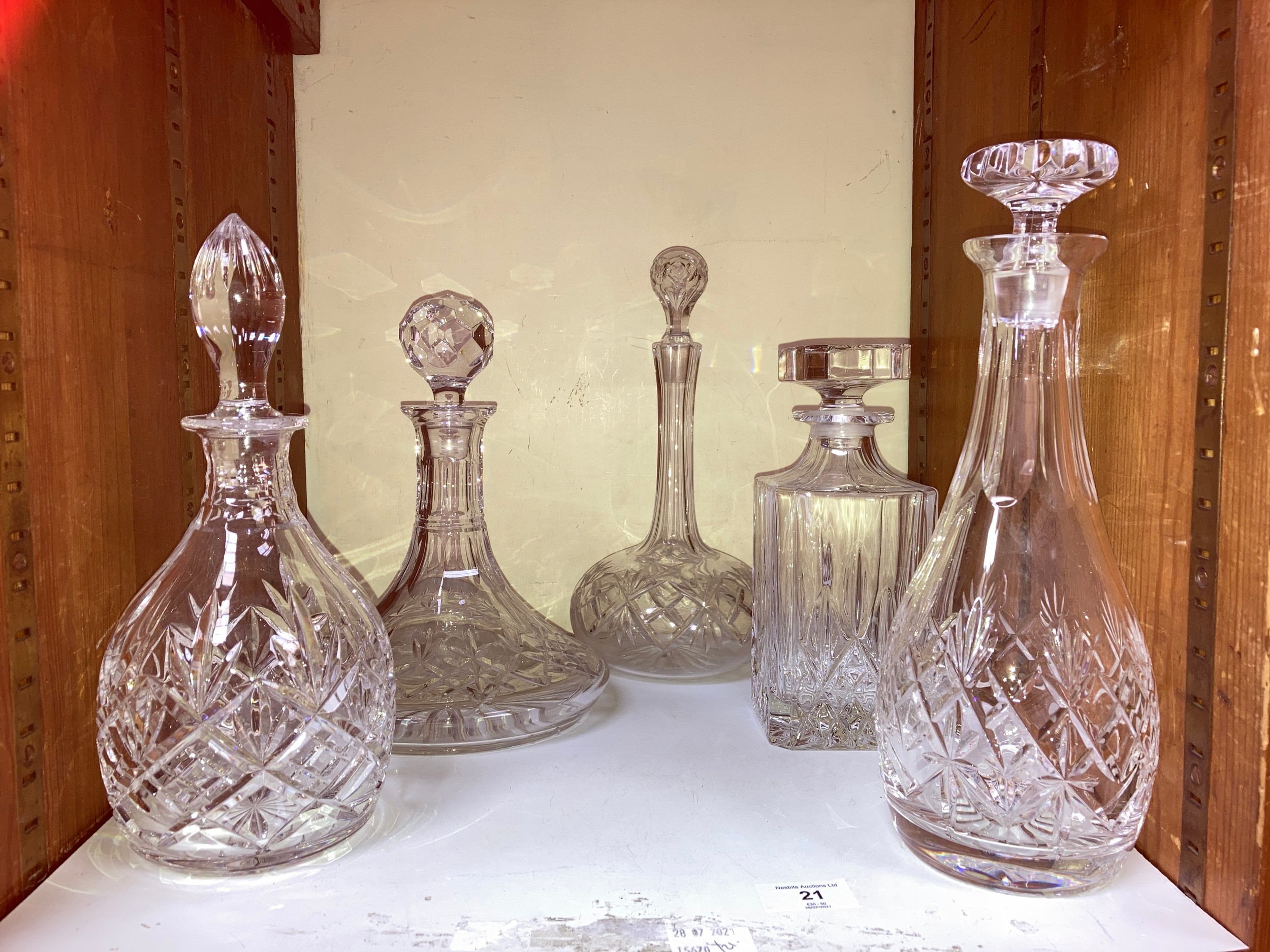 SECTION 21. Five assorted glass decanters