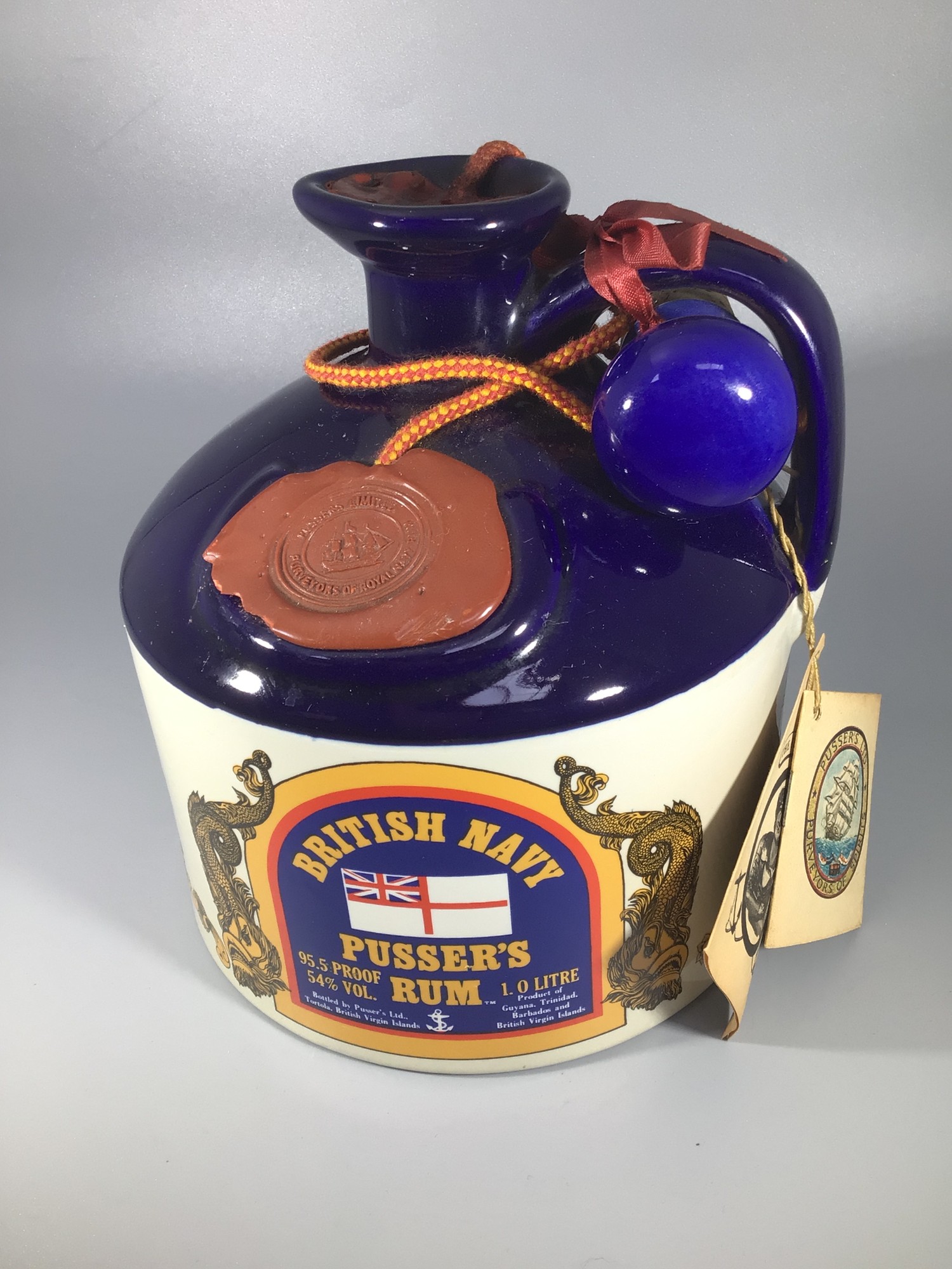 A litre of British Navy Pusser's rum 95.5 proof housed in a ceramic flagon, wax seal intact and with