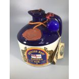 A litre of British Navy Pusser's rum 95.5 proof housed in a ceramic flagon, wax seal intact and with