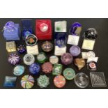 A collection of glass paperweights including some by Caithness with certificates along with
