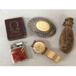 An Omega petrol lighter with original box, a silver and Ivory mounted belt buckle, Rotary wristwatch