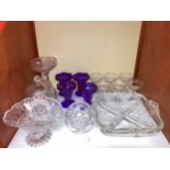 SECTION 9. A collection of cut glassware including a hors d'oeuvres dish, four blue fluted vases etc
