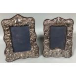 Two various ornate silver photo frames embossed with panels of angels etc. London, 1982, makers mark