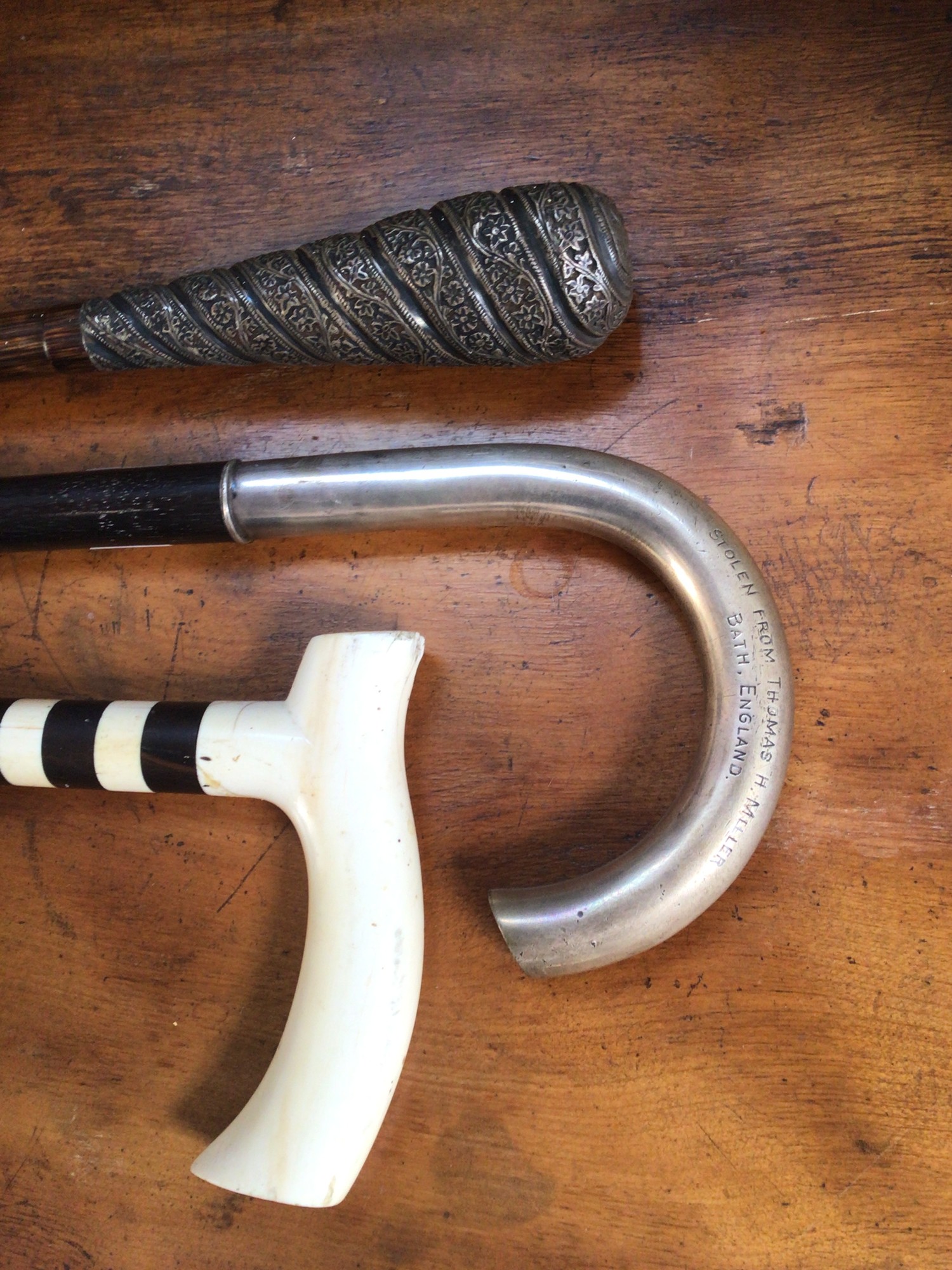 Three various late 19th / early 20th century walking sticks including one with a continental