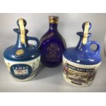 Two x 750ml Lamb's Navy Rum housed in ceramic decanters, one with HMS Warrior on the front, seals