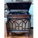 A mahogany cased Full-O-Tone cabinet gramophone with wind up handle, pair of cupboard doors
