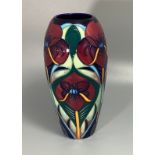 A Moorcroft pottery vase of elongated ovoid form, decorated in the 'Crowning Glory' pattern after