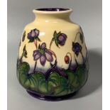 A Moorcroft pottery vase of ovoid form with flared rim, decorated in the 'Hepatica' pattern after