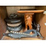 Various ethnic carved wooden items including a stool carved with elephant base and curved seat,