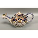 A French Faience/Quimper pottery armorial teapot, one side decorated with a coat of arms, the