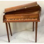 A Spinet by Arnold Dolmetsch, housed in a irregular hexagonal walnut case, with hinged lid