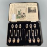 A cased set of twelve silver spoons and sugar tongs, Sheffield, 1939, maker's mark of Harrison
