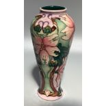 A Moorcroft pottery vase of inverted baluster form in the 'Blakeney Mallow' pattern after Sarah