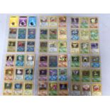 A collection of approximately 600 early and later Pokemon cards, loose and in plastic sleeves,