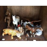 A collection of assorted ceramic animal figures, predominantly Beswick examples comprising horses, a