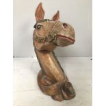 A carved and painted wooden horse's head with head tilted slightly left, probably from a