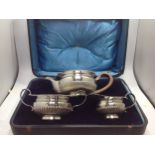 An Edwardian silver three-piece silver tea set, of compressed globular form with gadrooned rim and