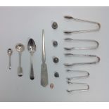 A small collection of assorted silver comprising five pairs of sugar tongs, spoons and three various