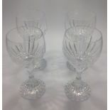 A set of four Baccarat Massena pattern crystal wine glasses, each with etched marks to bases, 18cm