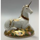 A Royal Crown Derby paperweight, 'Mythical Unicorn', with printed marks to base and gold stopper,