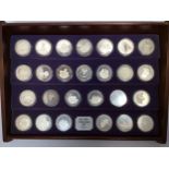 The New Elizabethan Age' A cased set of twenty six solid silver coins commemorating Queen