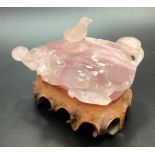 A Chinese carved rose quartz inkwell modelled as peach, with bird finial to the well cover, 12cm
