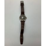 A 1940 Tissot Aquasport gentleman's wristwatch with steel case, matt black dial and gilt Arabic