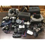 Ten various Canon cameras including EOS 500 (2), EOS 300, EOS 100, T50, Z135, T70 and other Sure