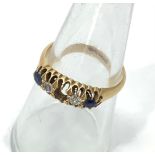 An 18ct yellow gold sapphire and diamond ring, (middle sapphire missing)ring weighs 3.6 grams,