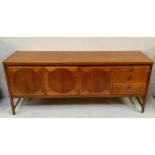 A mid-20th century Nathan Circles teak sideboard, with a pair of cupboard doors enclosing a narrow