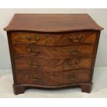An 18th century inlaid mahogany chest of drawers, of serpentine form with four faux-figured