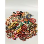 A large selection of costume jewellery including strings of beads, earrings and various bracelets.