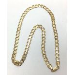 A 9ct gold flat curb chain, weighing 20.0 grams, length 20 inches.
