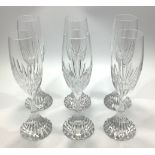 A set of six Baccarat Massena pattern crystal champagne flutes, each with etched marks to bases,