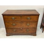 An 18th century oak chest of drawers with planked top, converted from a chest on chest, three