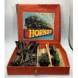A clockwork O gauge Hornby Train Goods Set No. 20 together with four miniature jointed teddy