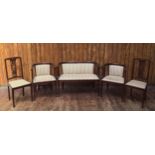 An Edwardian seven piece parlour suite, comprising settee, four standard chairs and two carvers,