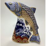 A Royal Crown Derby paperweight, 'Leaping Salmon', with printed marks to base and gold stopper,